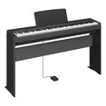 Diagonal side view of the P-143BTB (black model) in combination with the optional stand and sustain pedal